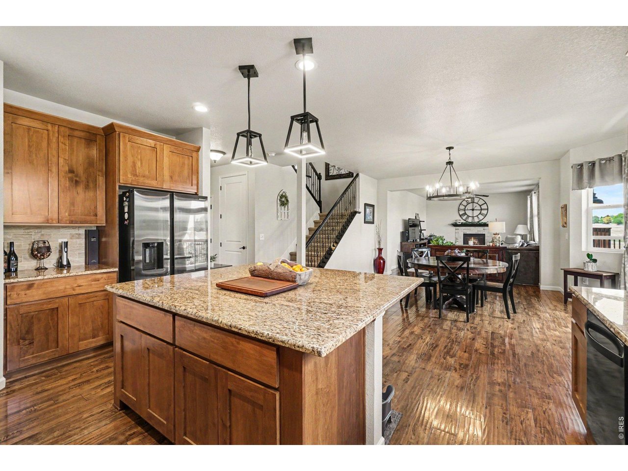 1124 Wagon Bend Road Berthoud, CO 80513 - Photo 13 of 38 kitchen facing hall entry, stairs dining & living room