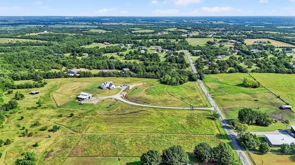 a view of a swimming pool with a yard
