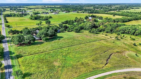 an aerial view of a houses with outdoor space and street view