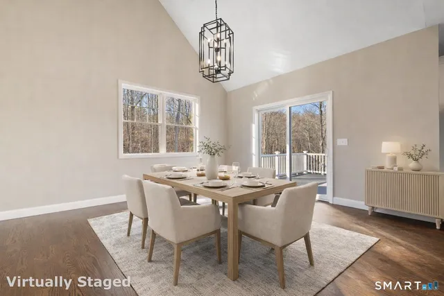 a dining room with furniture and window