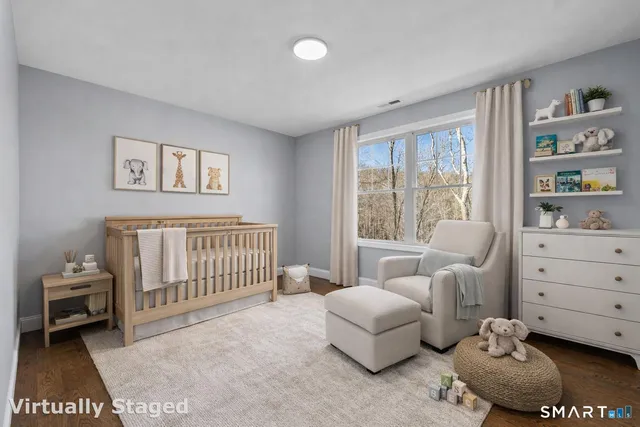 a bedroom with furniture and a window