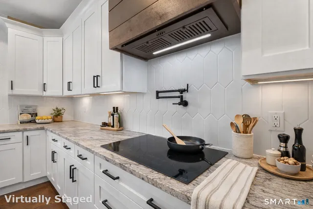 a kitchen with a sink and cabinets