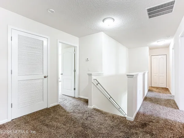 a view of hallway with stairs