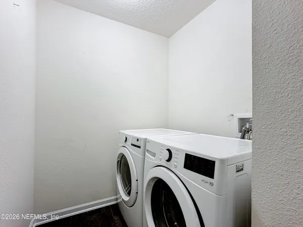 a utility room with dryer and washer