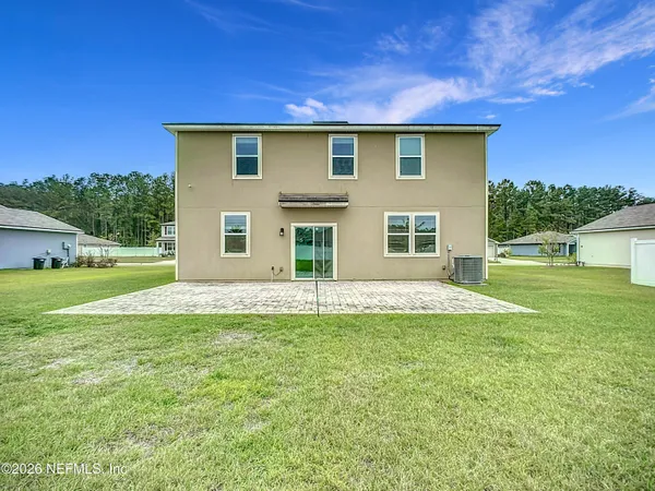a house that has a big yard in front of it