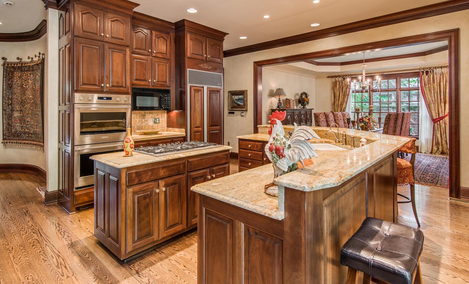 4334 Sneed Road Nashville, TN 37215 - Photo 8 of 30 a kitchen with stainless steel appliances granite countertop a stove and a refrigerator