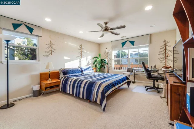 a bedroom with bed and a large mirror