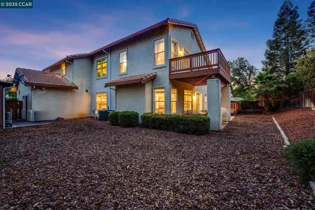 a view of a bench in the backyard