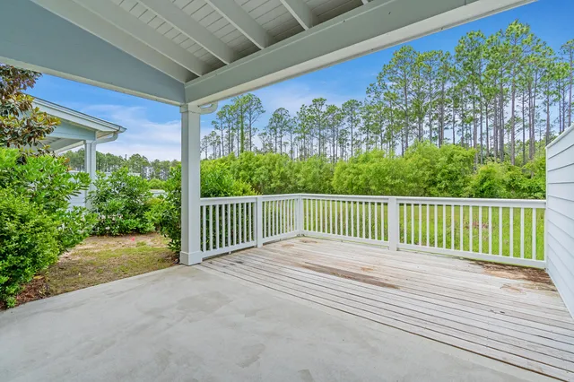 a view of balcony with lots of green space
