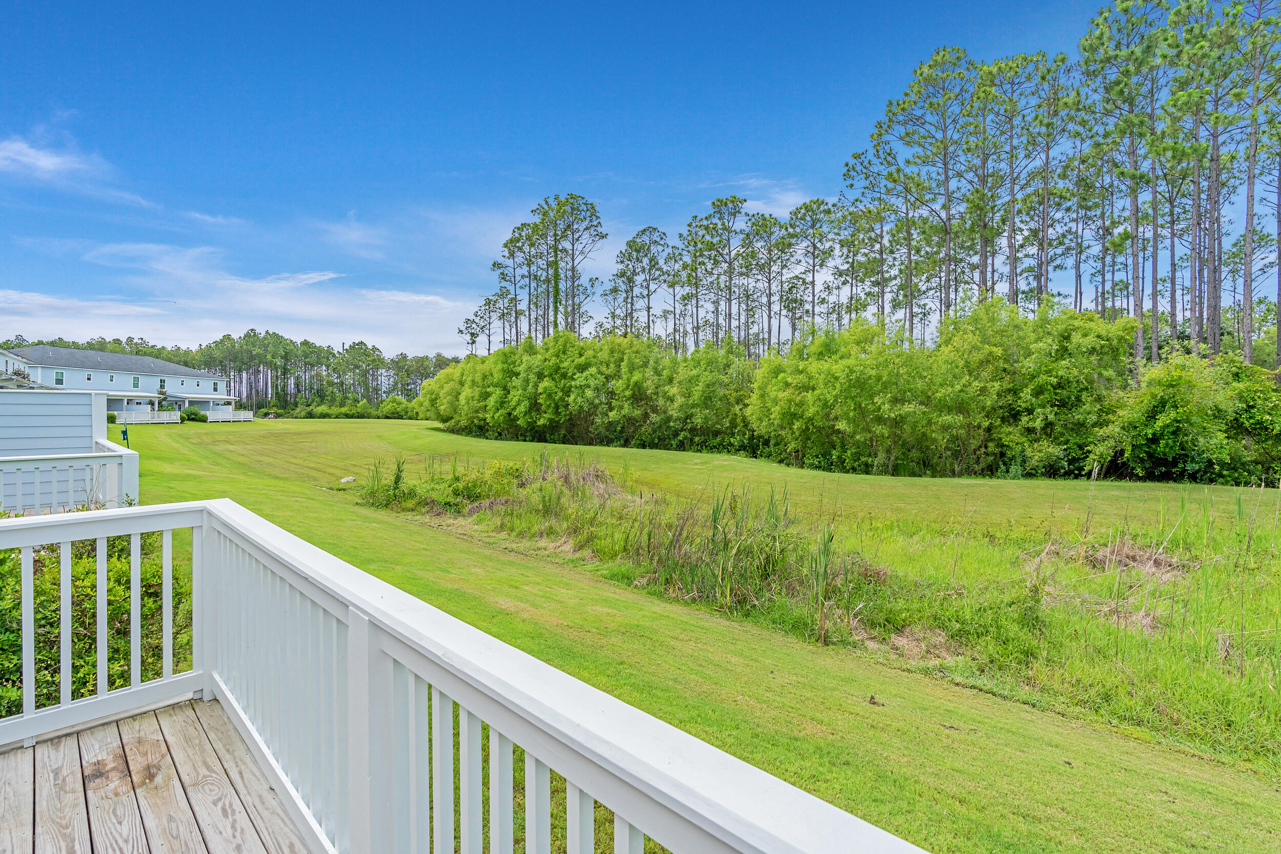 36 Golden Bell Ct Inlet Beach, Unit 36C Inlet Beach, FL 32461 - Photo 4 of 48 a view of a green field with sitting area