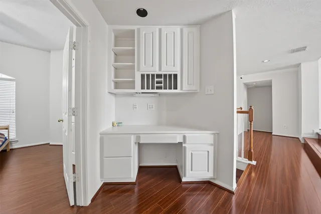 a view of kitchen with furniture and wooden floor