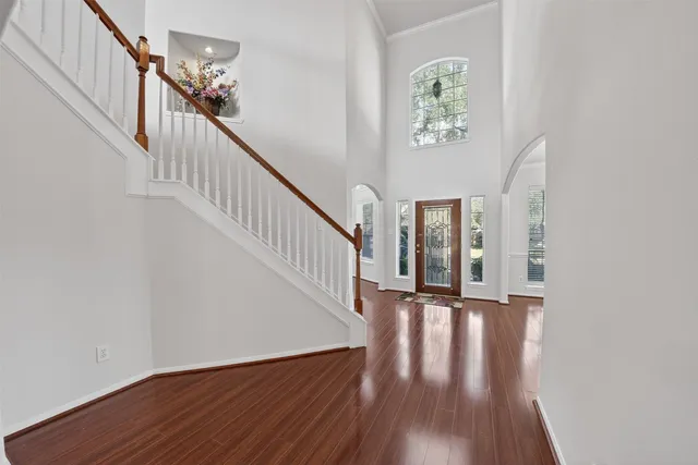 a view of an entryway with wooden floor