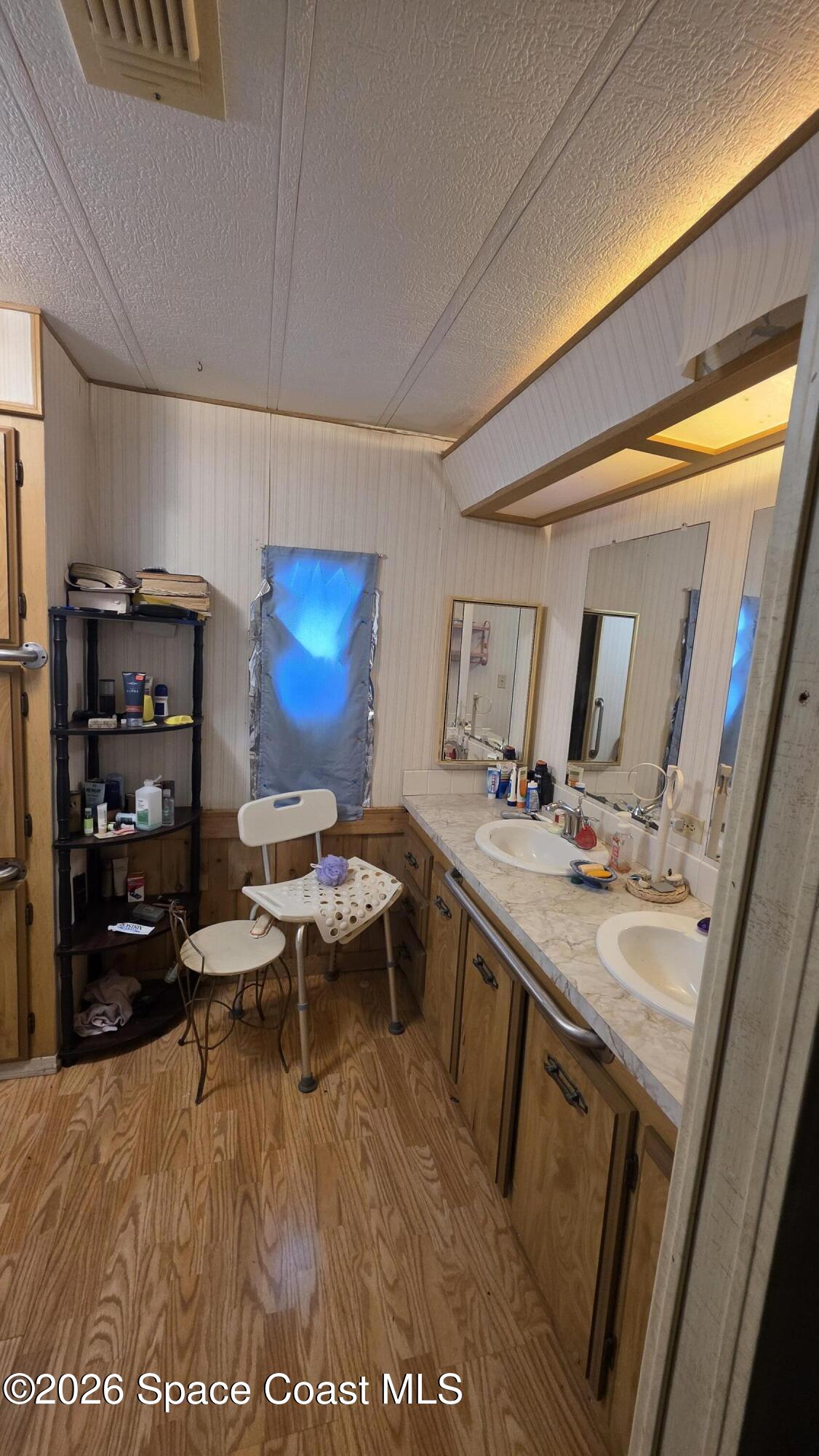 1805 Mango Street Northeast Palm Bay, FL 32905 - Photo 17 of 22 a living room with furniture and a flat screen tv