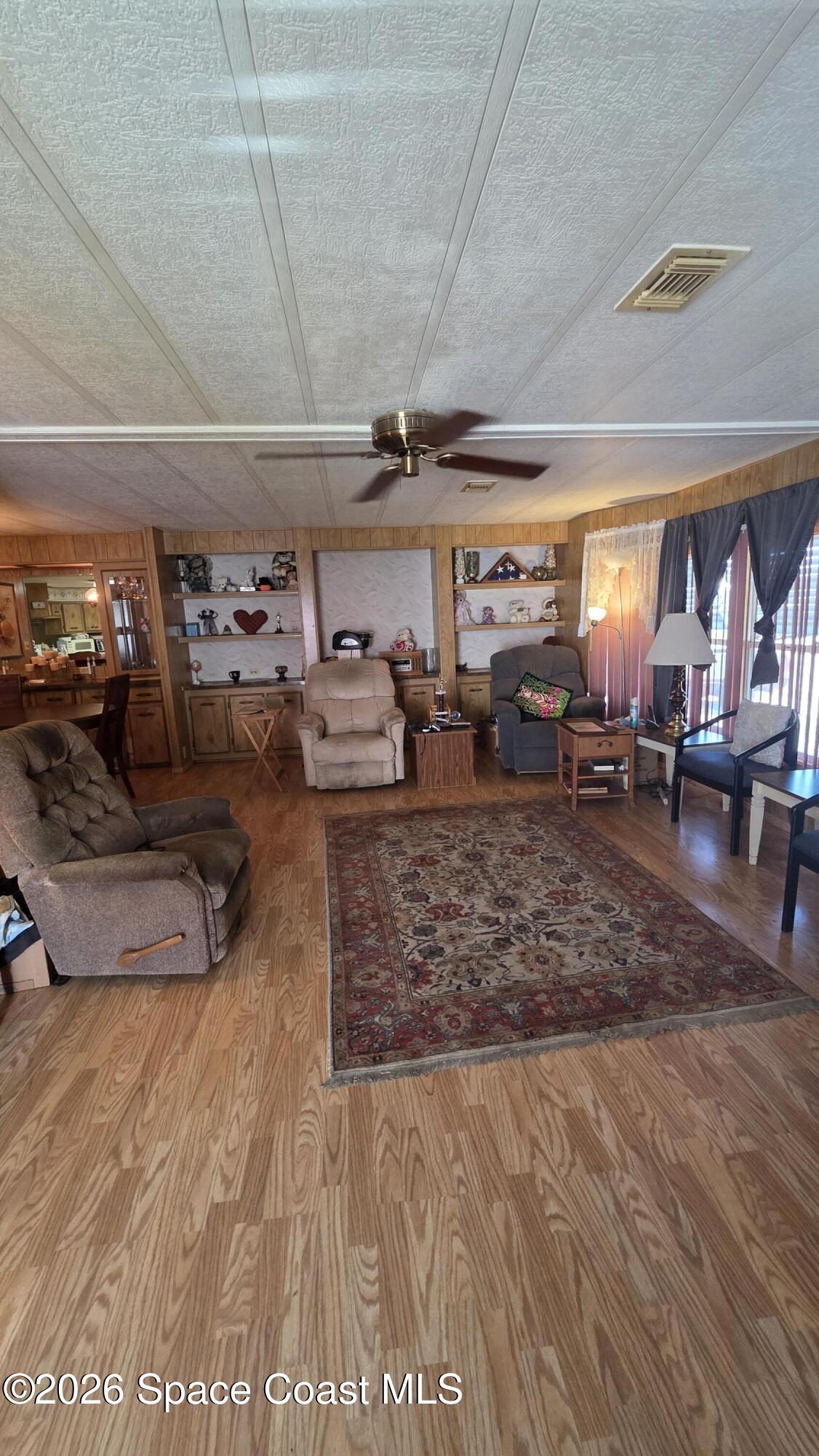 1805 Mango Street Northeast Palm Bay, FL 32905 - Photo 4 of 22 a view of a room with lots of wooden furniture