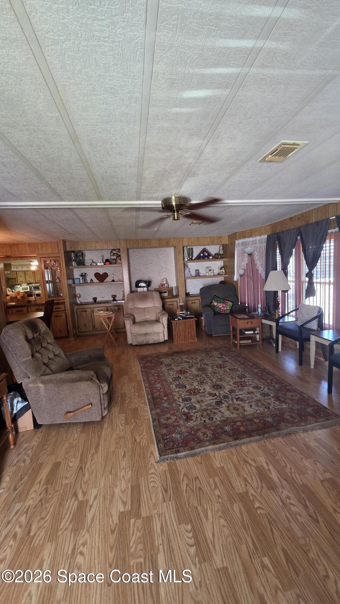 1805 Mango Street Northeast Palm Bay, FL 32905 - Photo 5 of 22 a living room filled with furniture