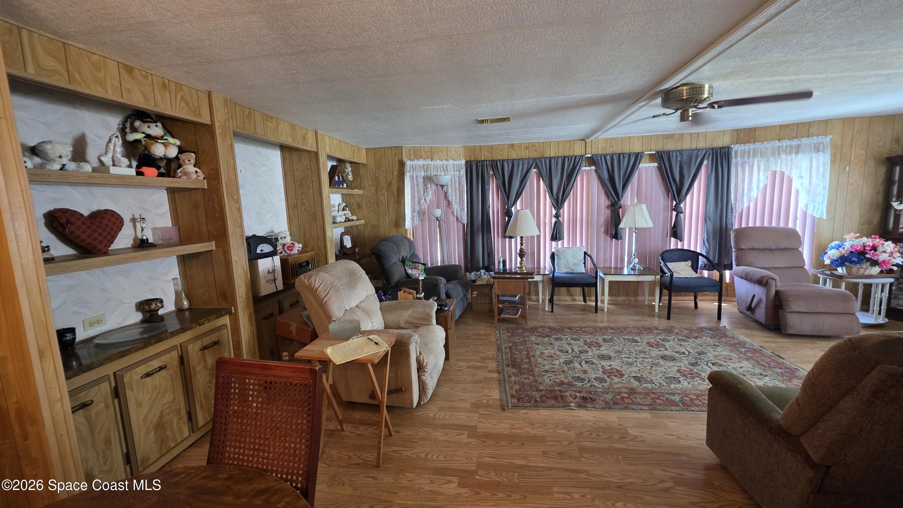 1805 Mango Street Northeast Palm Bay, FL 32905 - Photo 6 of 22 a living room with furniture and a window