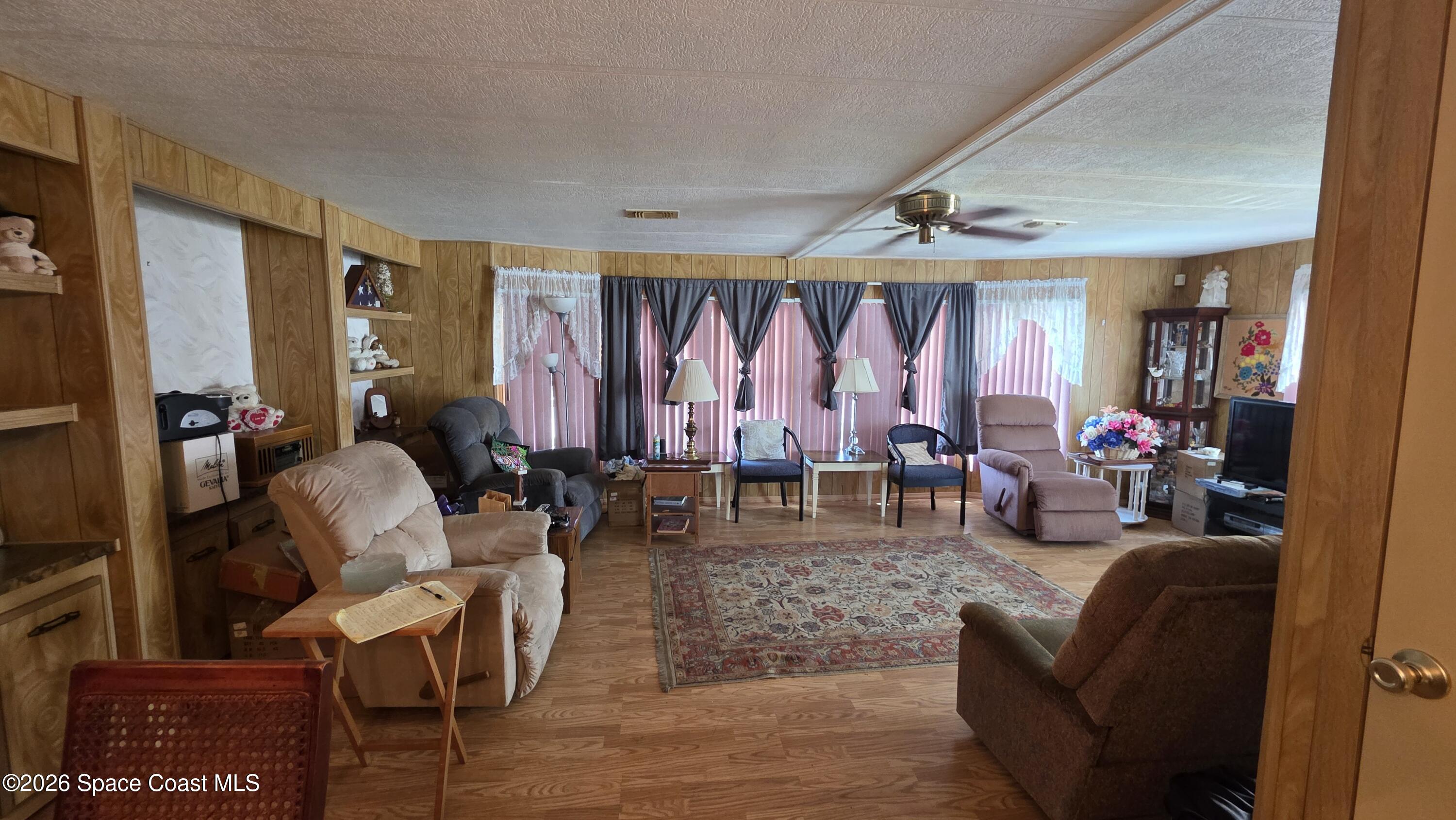 1805 Mango Street Northeast Palm Bay, FL 32905 - Photo 7 of 22 a living room with furniture and a window