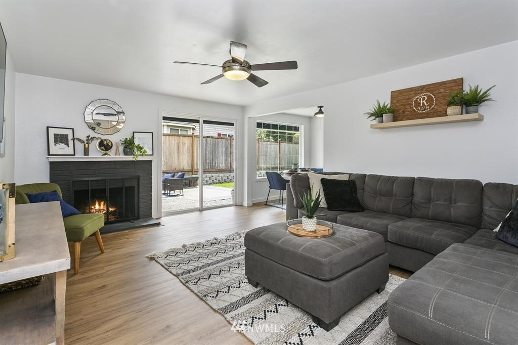 17821 Brook Boulevard Bothell, WA 98012 - Photo 3 of 21 a living room with furniture and a fireplace