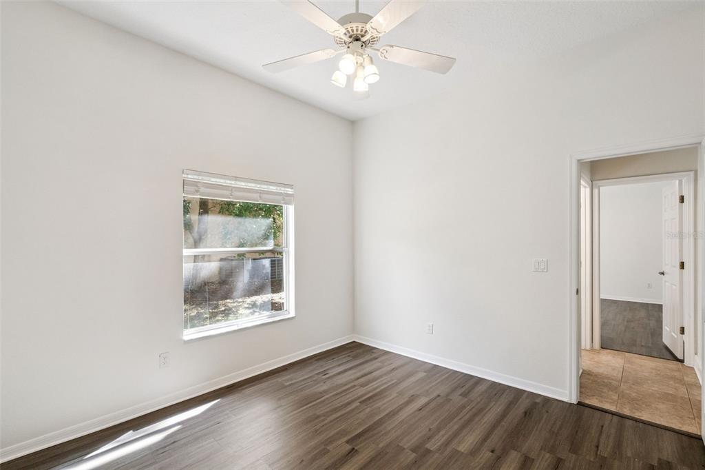 2541 Teton Stone Run Orlando, FL 32828 - Photo 42 of 82 a view of an empty room with window and wooden floor