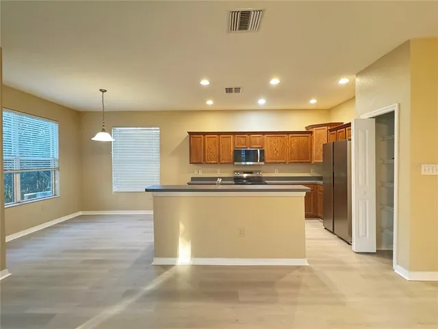 a view of empty room with window and fireplace