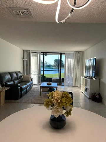 a lobby with furniture and floor to ceiling window