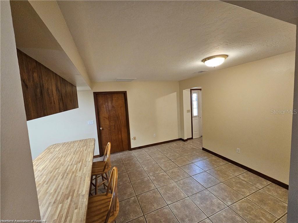 511 Elgin Street Sebring, FL 33875 - Photo 16 of 30 a view of a livingroom with wooden floor