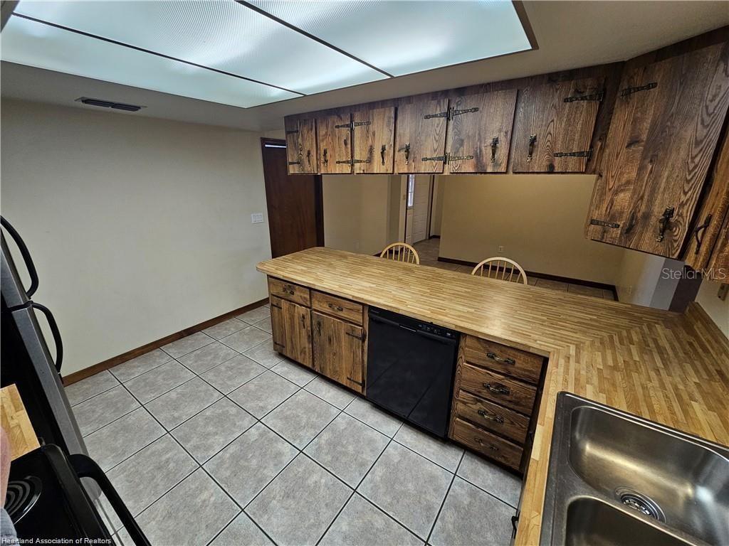 511 Elgin Street Sebring, FL 33875 - Photo 25 of 30 a view of kitchen with stainless steel appliances cabinets