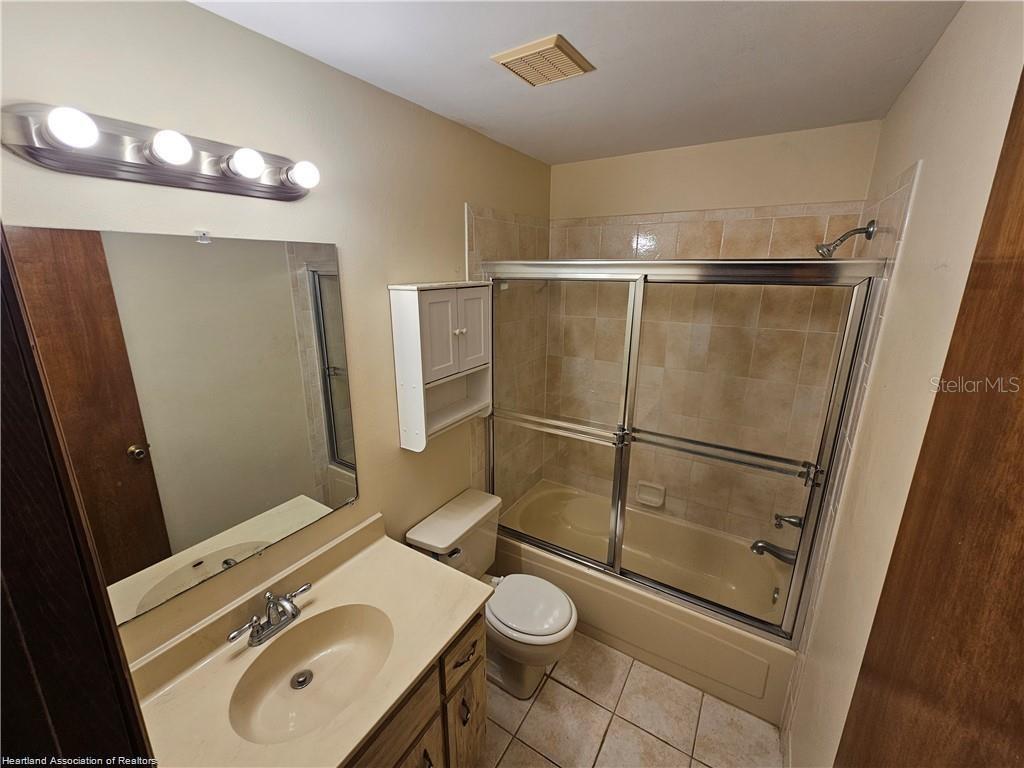 511 Elgin Street Sebring, FL 33875 - Photo 27 of 30 a bathroom with a sink toilet and shower