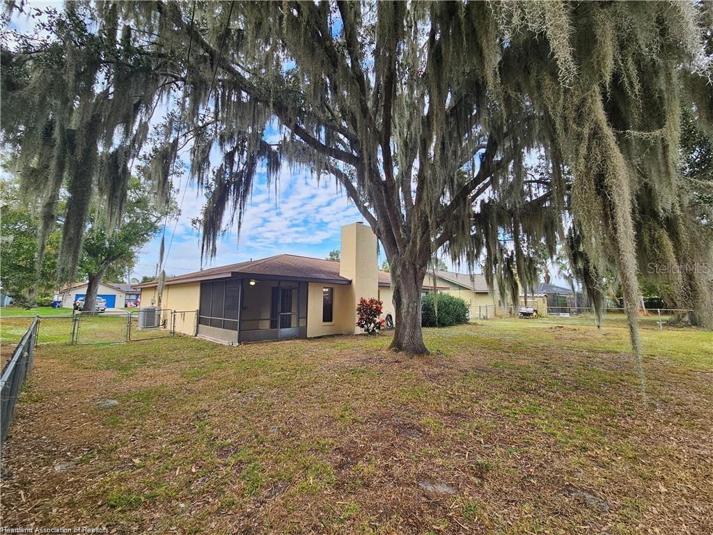 511 Elgin Street Sebring, FL 33875 - Photo 5 of 30 a view of a house with a yard