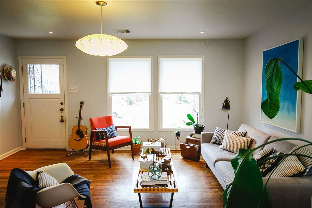 a living room with furniture and a large window