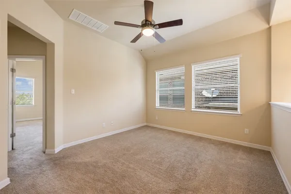 a view of an empty room with a window