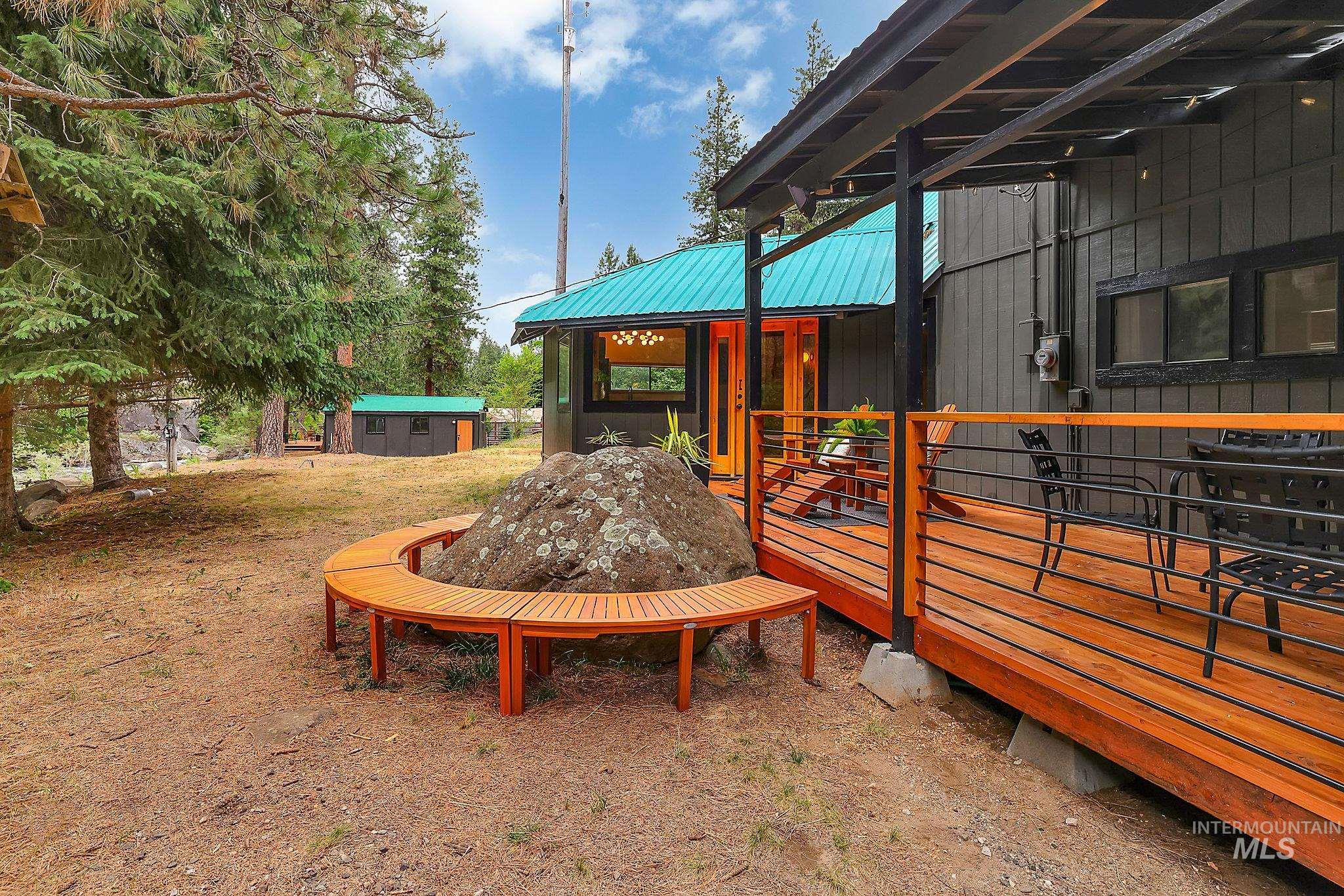 5713 Pines Road New Meadows, ID 83654 - Photo 16 of 45 View of playground featuring a shed and a deck
