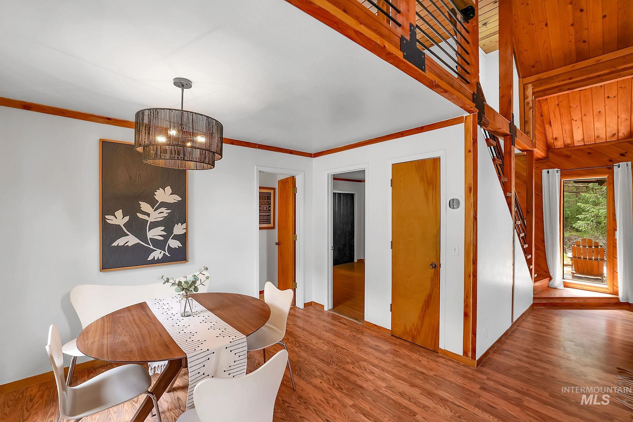 5713 Pines Road New Meadows, ID 83654 - Photo 20 of 45 Dining area with wood finished floors and hanging lights