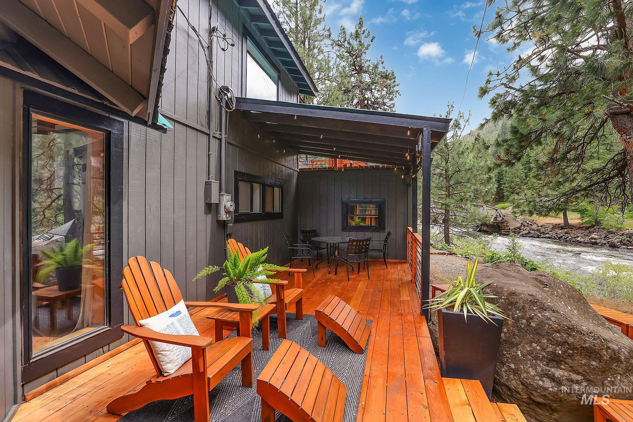 5713 Pines Road New Meadows, ID 83654 - Photo 2 of 45 Wooden deck featuring outdoor dining space