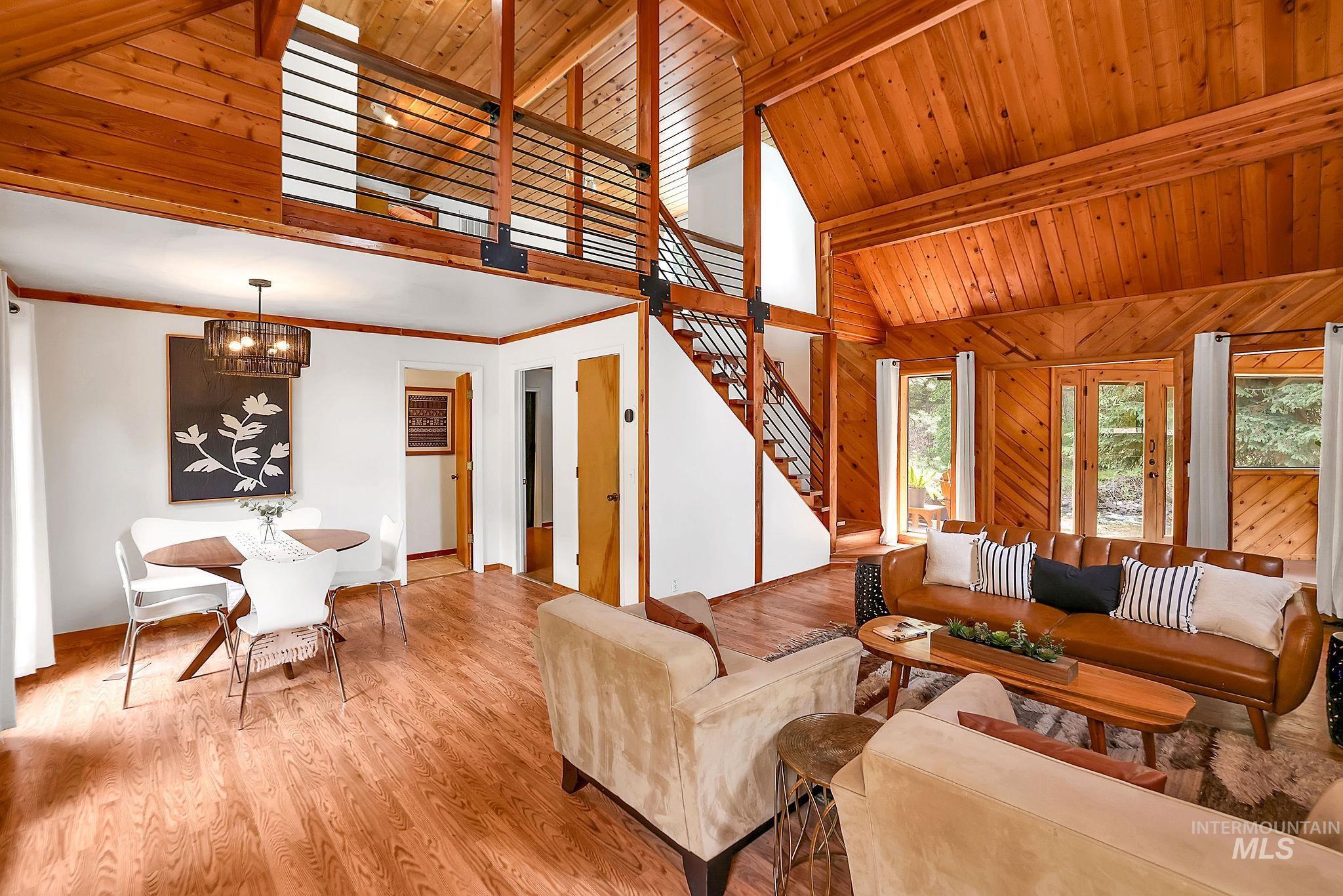 5713 Pines Road New Meadows, ID 83654 - Photo 25 of 45 Living area with a high wooden beamed ceiling, wooden walls, and wood finished floors