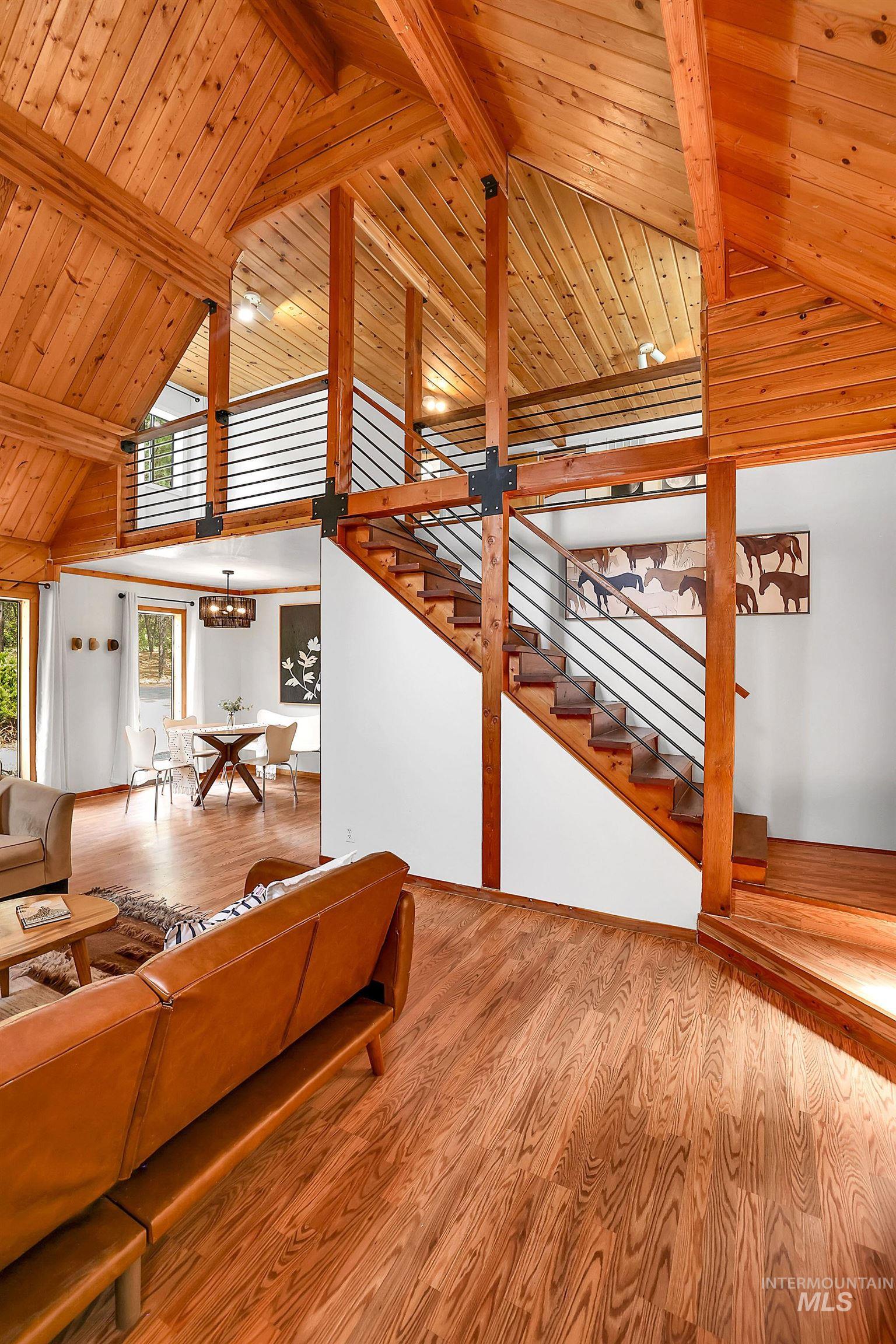5713 Pines Road New Meadows, ID 83654 - Photo 26 of 45 Living area featuring light wood-style flooring and a high wood beamed ceiling