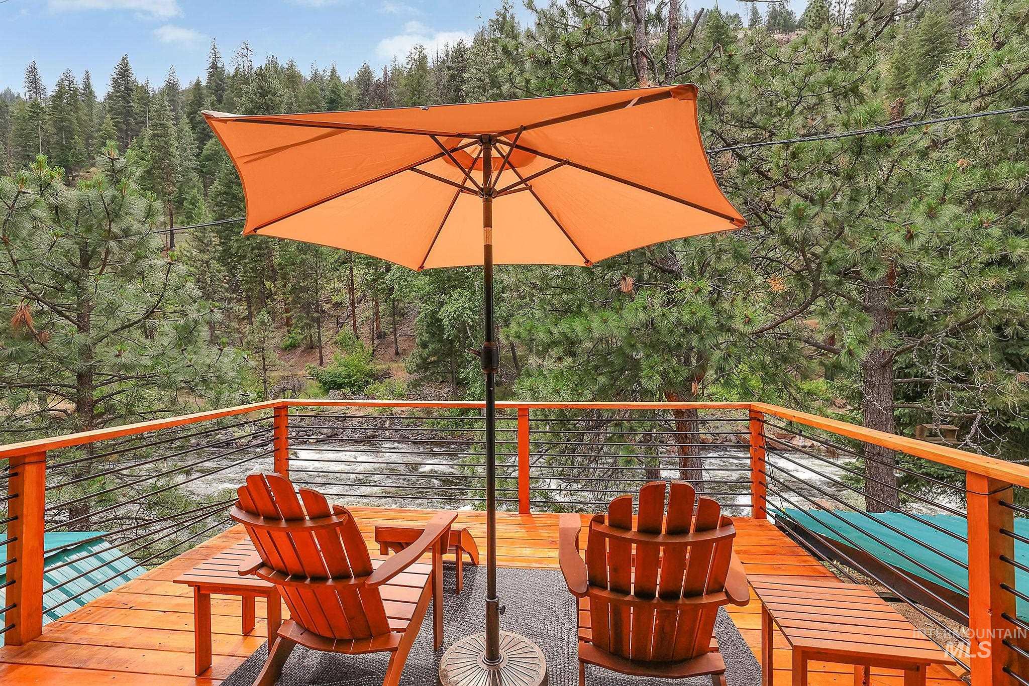 5713 Pines Road New Meadows, ID 83654 - Photo 3 of 45 Deck with a wooded view