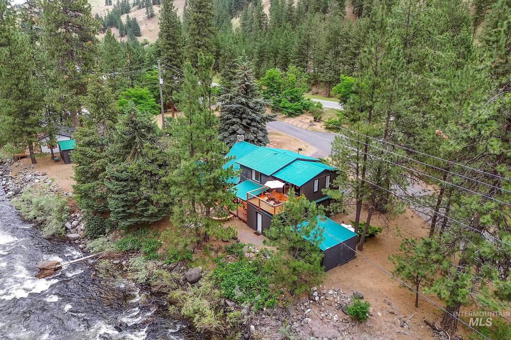 5713 Pines Road New Meadows, ID 83654 - Photo 36 of 45 Aerial view of property and surrounding area featuring a tree filled landscape