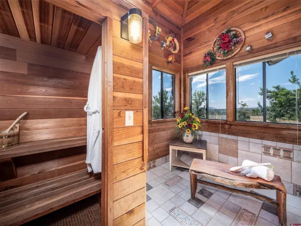 a view of a balcony with wooden floor