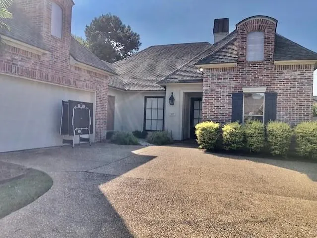 a front view of a house with garden