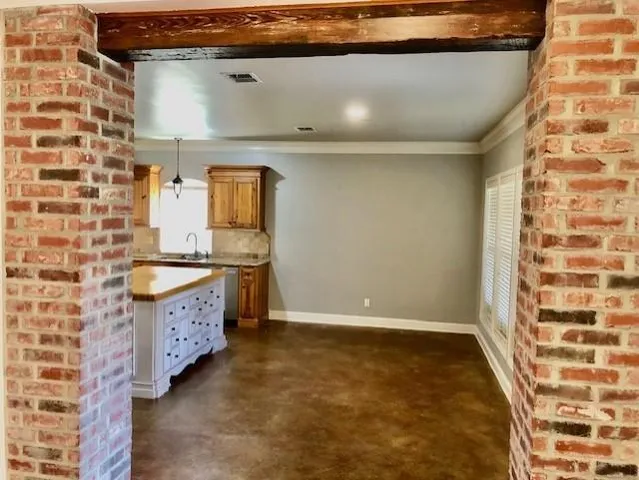 a bathroom with a granite countertop sink a vanity and a mirror
