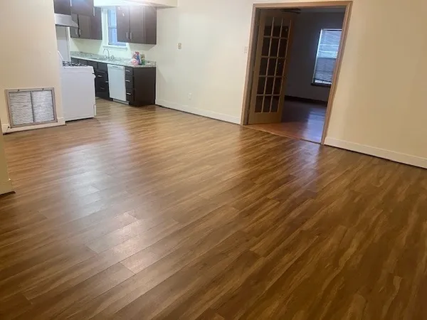 a view of a kitchen from the hallway