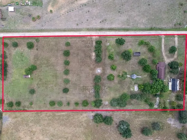 an aerial view of beach and swimming pool