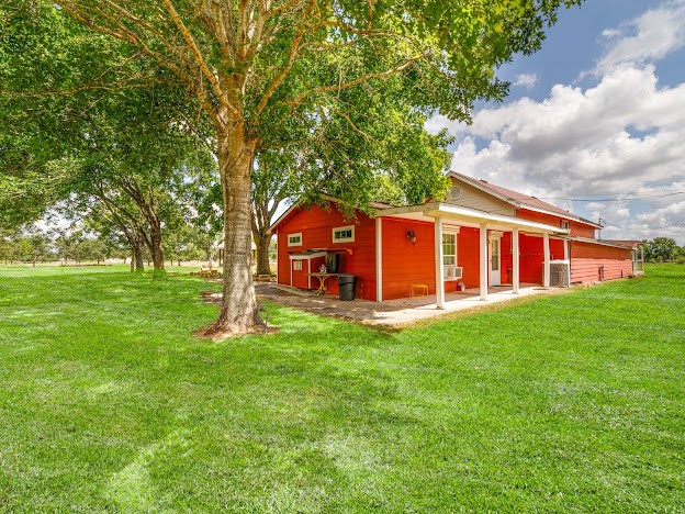 13025 Battle Road Beasley, TX 77417 - Photo 2 of 13 a view of a house with a backyard