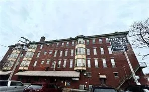 a front view of a building with glass windows