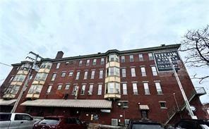 92 West Main Street, Unit 210 Uniontown, PA 15401 - Photo 3 of 13 a front view of a building with glass windows