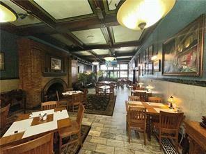 92 West Main Street, Unit 210 Uniontown, PA 15401 - Photo 6 of 13 a dining room with furniture a chandelier and wooden floor