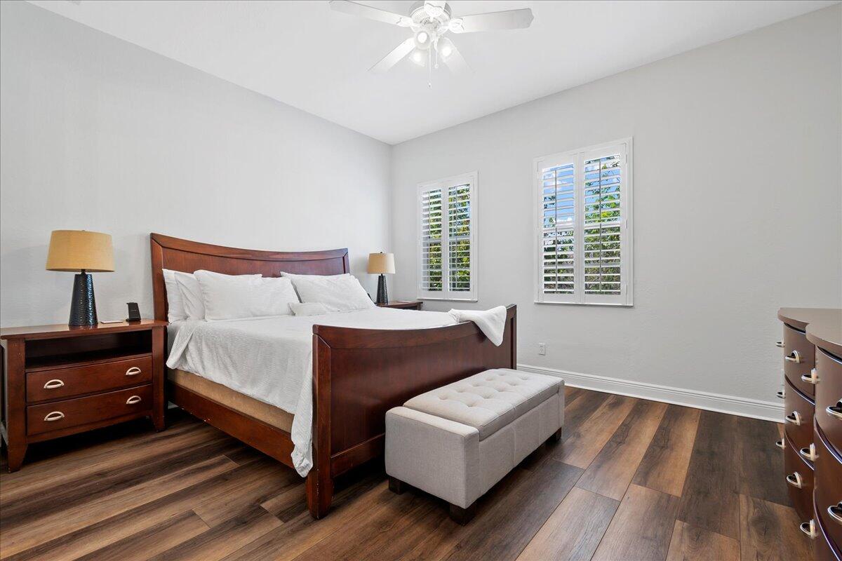 251 Edenberry Avenue Jupiter, FL 33458 - Photo 12 of 31 a bedroom with a bed and a window