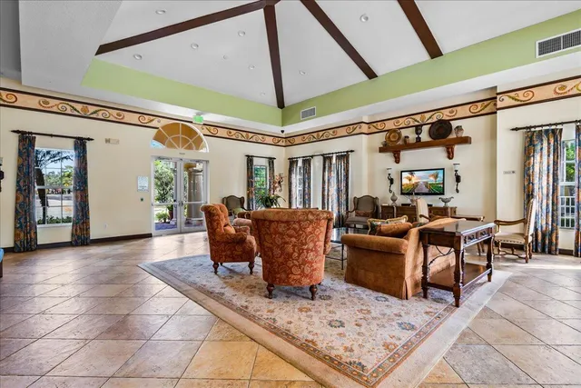 a living room with furniture a window and a table