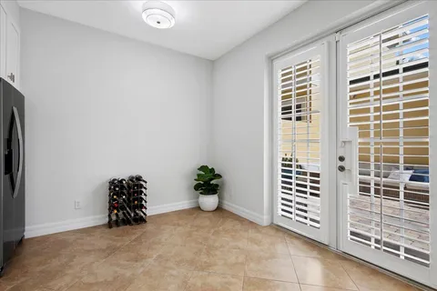 a view of a livingroom with wooden floor and a window